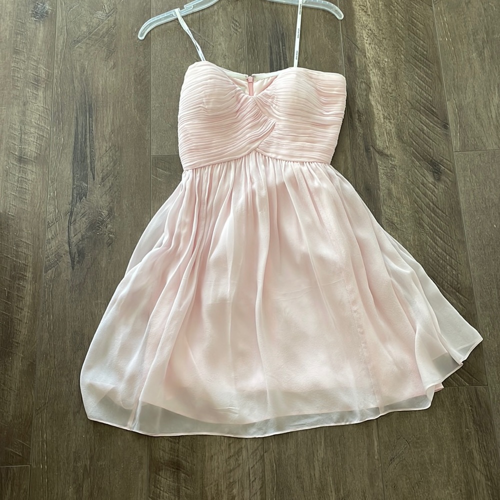 Light pink Donna Morgan bridesmaid dress